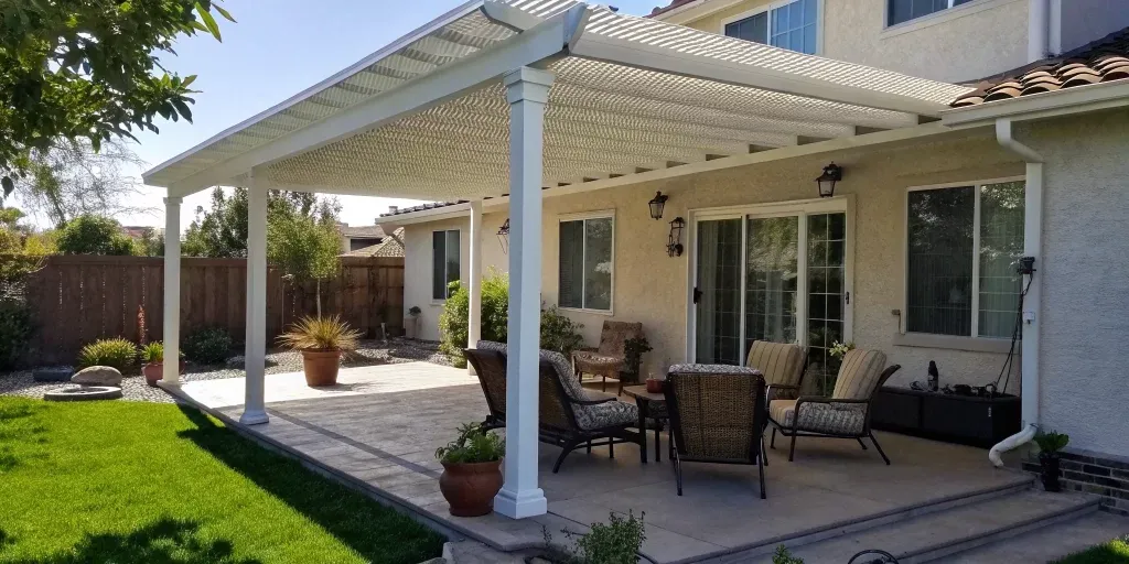 DIY Alumawood patio cover installation over a finished backyard patio.